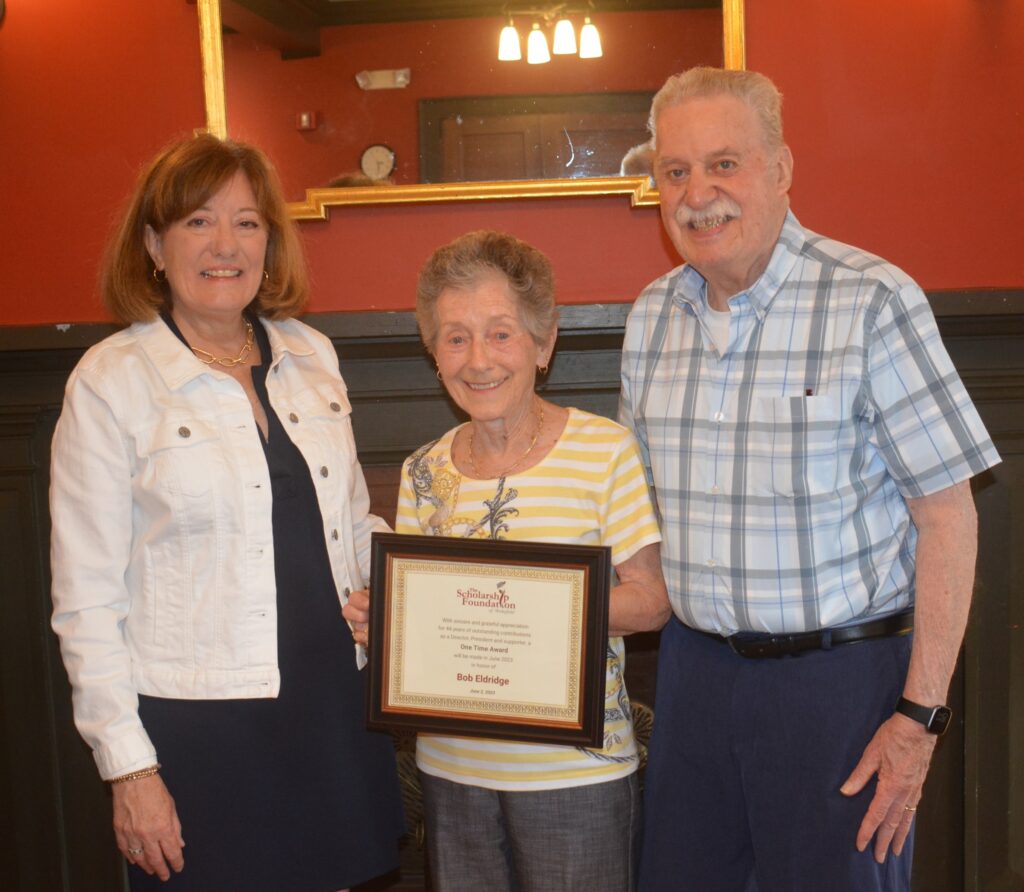 Photo of Bob and Merry Eldridge accepting award with Kathy Scanlon