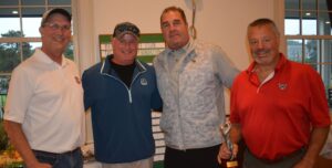 Players from the 1st Place team at TSF’s recent 37th Annual Golf Tournament, being congratulated by TSF Vice President T.J. White (on left), are Howie Melanson, Paul Carangelo, and Matt Yardumian. 