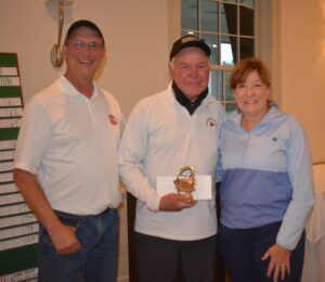 Longest Drive winner Perry Verge (center) is congratulated by  T.J. White and Kathy Scanlon of TSF at the 37th Annual Golf Tournament to benefit The Scholarship Foundation of Wakefield.   