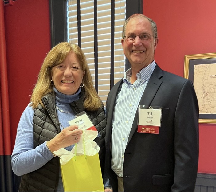 Photo of Kathy Scanlon, the 2025 Patricia B. Mooney Volunteer Recognition Award recipient, is congratulated by TSF President T.J. White